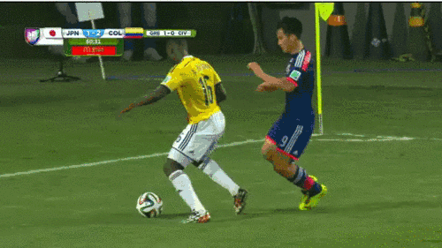 Balanta of team Columbia elbows Okazaki of team Japan